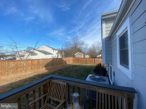 a view of a wooden deck and a yard