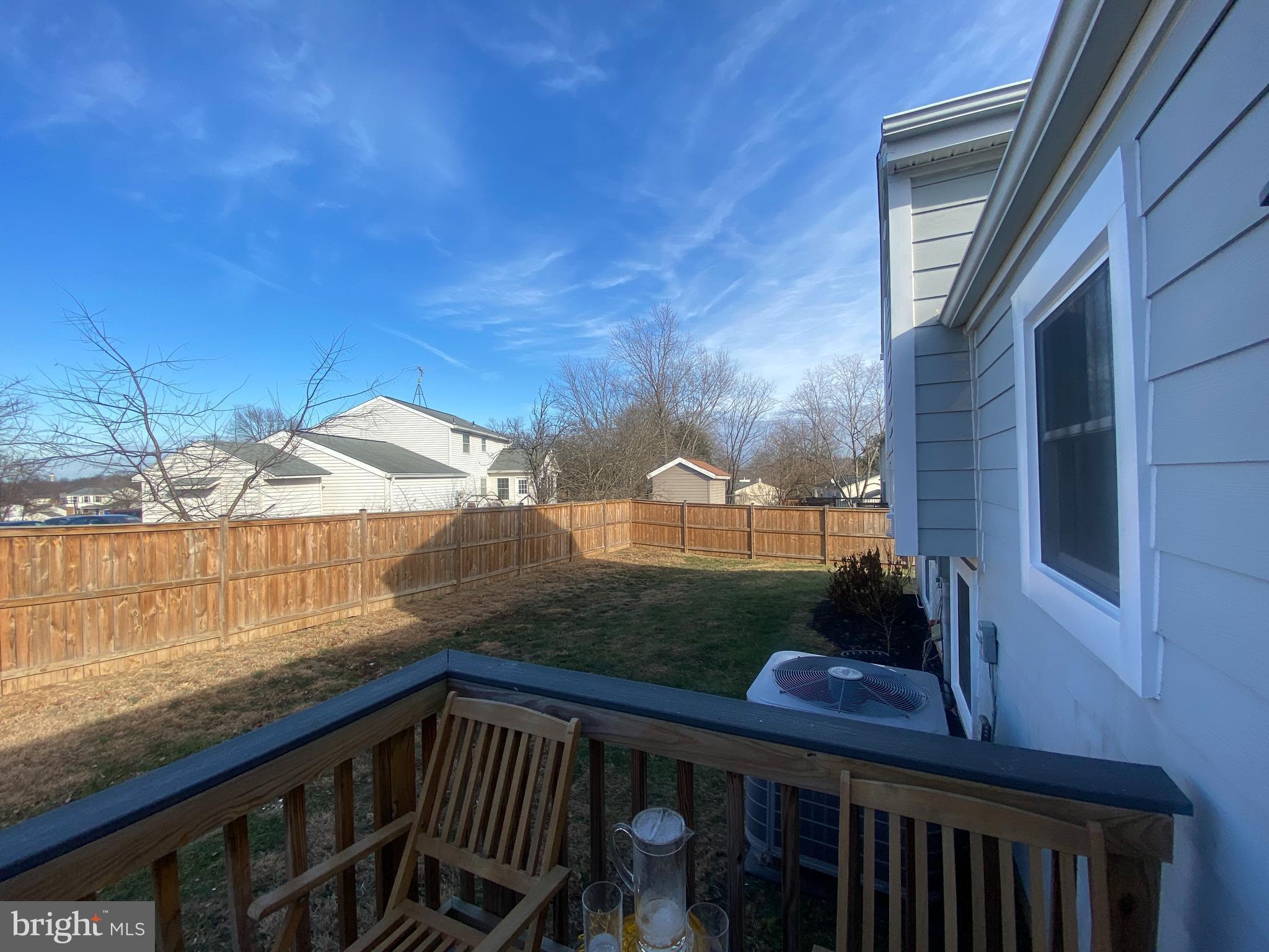 4426 Cub Run Road Chantilly, VA 20151 - Photo 21 of 24 a view of a balcony with wooden floor and fence