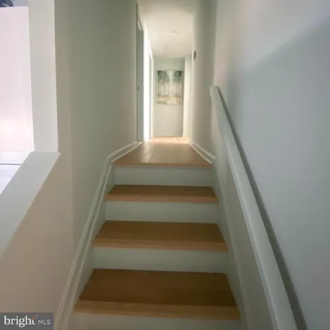 a bedroom with bed and a window