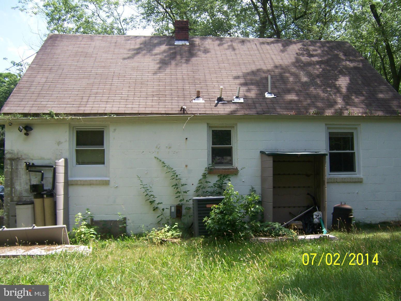 8313 Allentown Road Fort Washington, MD 20744 - Photo 2 of 10 a house with lots of trees in the background