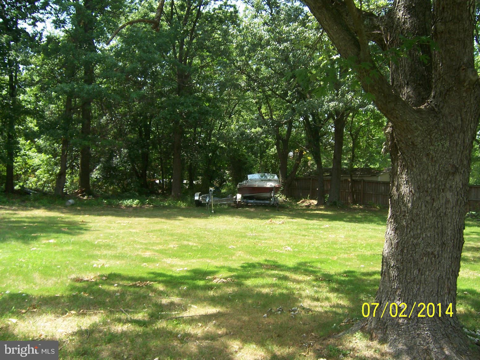 8313 Allentown Road Fort Washington, MD 20744 - Photo 4 of 10 a view of a swimming pool with a bench and trees
