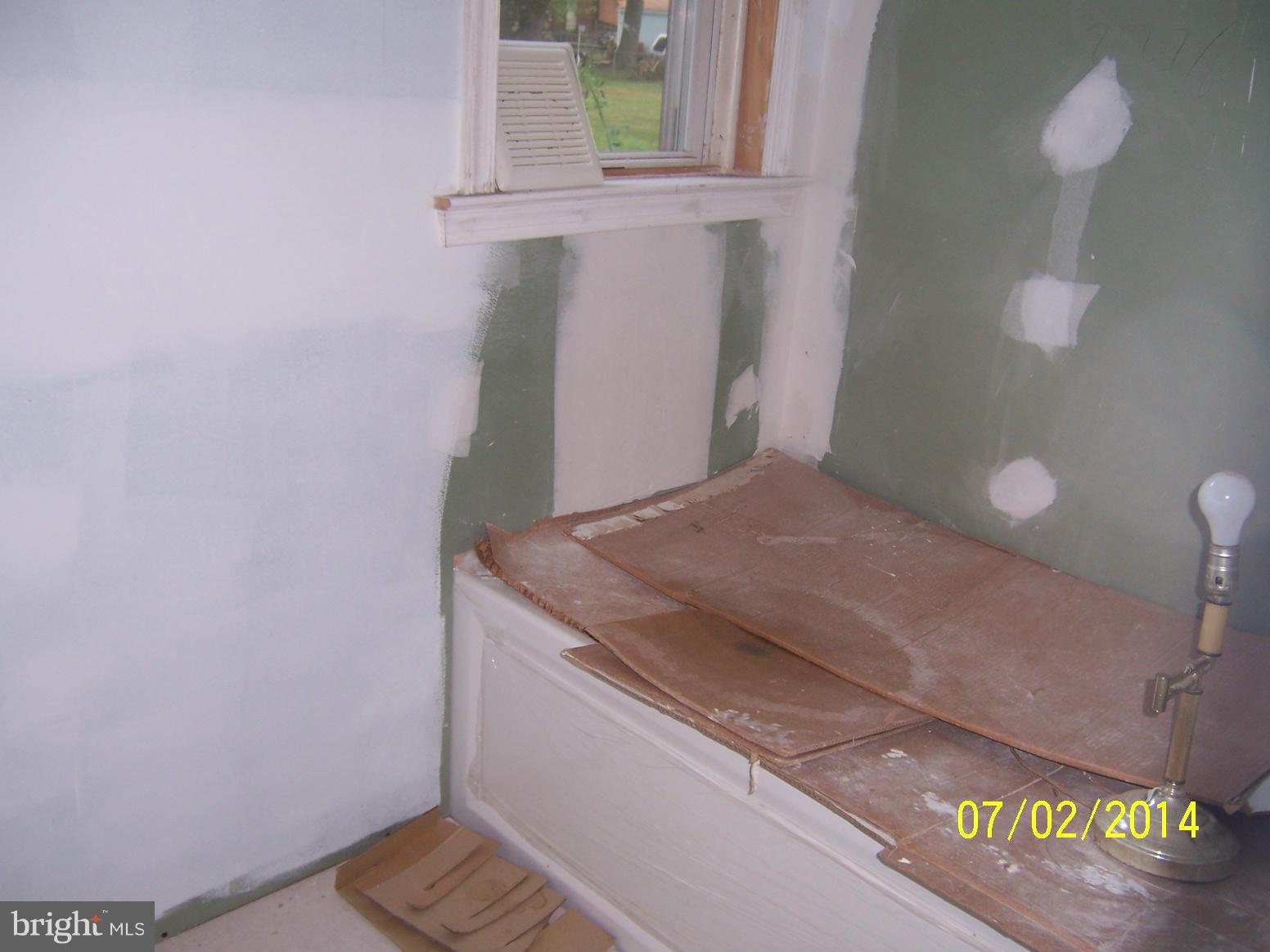 8313 Allentown Road Fort Washington, MD 20744 - Photo 5 of 10 a bathroom with a granite countertop sink and a mirror