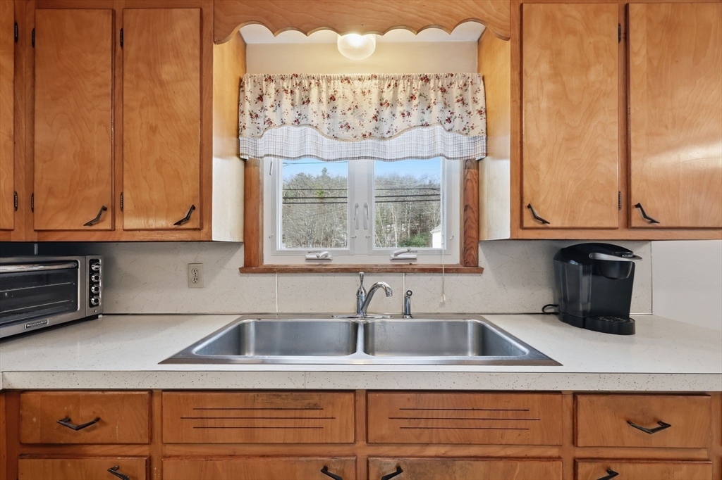 4452 High Street Palmer, MA 01069 - Photo 12 of 41 a kitchen with a sink and cabinets