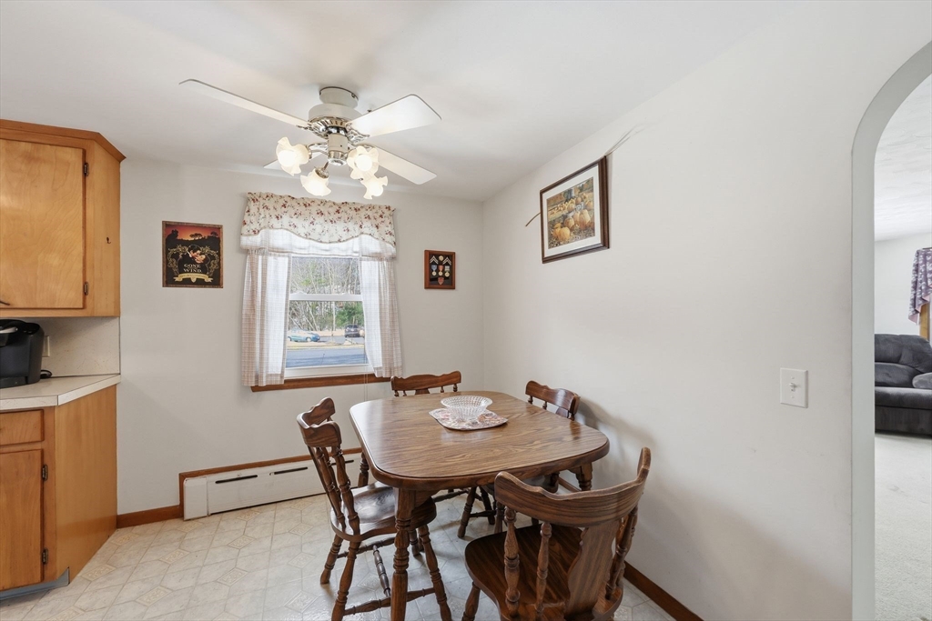 4452 High Street Palmer, MA 01069 - Photo 19 of 41 a view of a dining room with furniture and chandelier