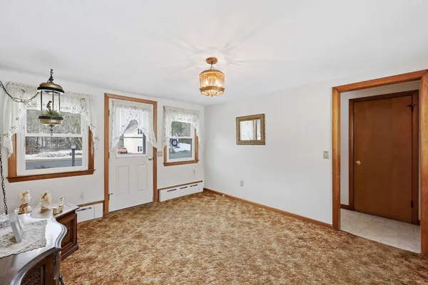 a view of livingroom with furniture and window