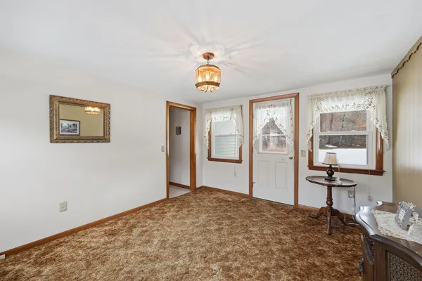 a bedroom with a bed and a table in it