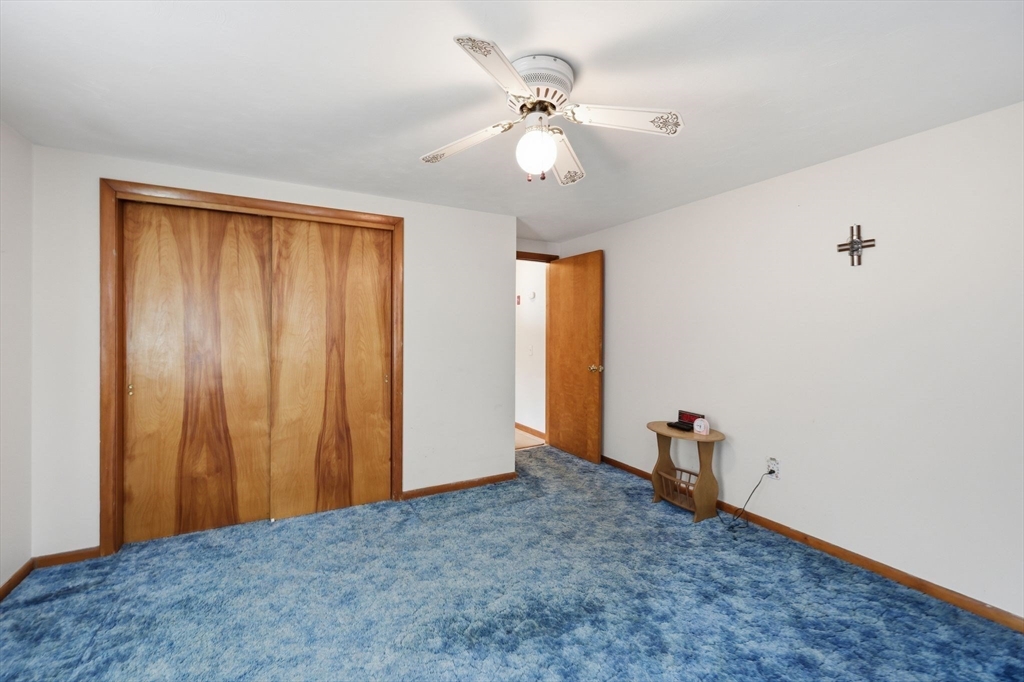 4452 High Street Palmer, MA 01069 - Photo 24 of 41 a view of an empty room with a fan