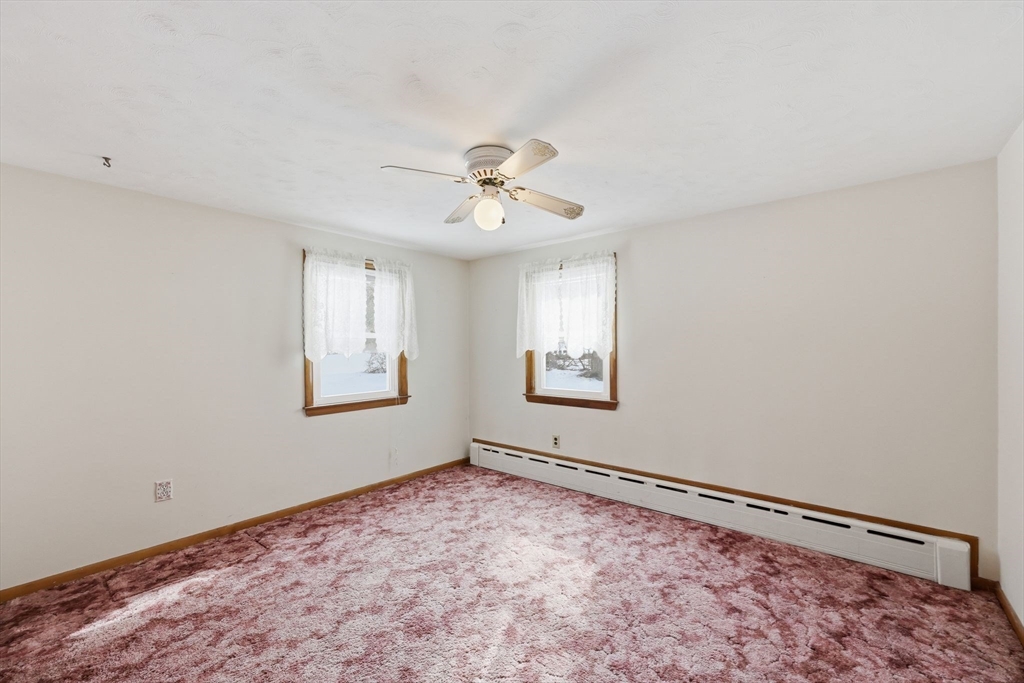 4452 High Street Palmer, MA 01069 - Photo 26 of 41 a view of a big room with window and chandelier fan