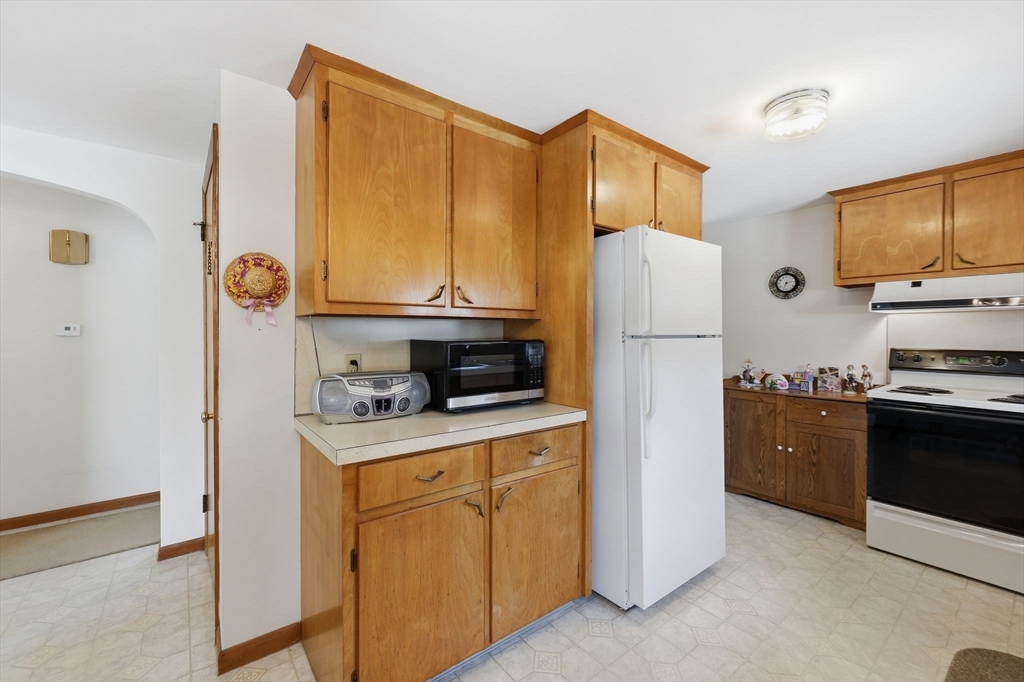 4452 High Street Palmer, MA 01069 - Photo 9 of 41 a kitchen with stainless steel appliances a refrigerator stove and sink