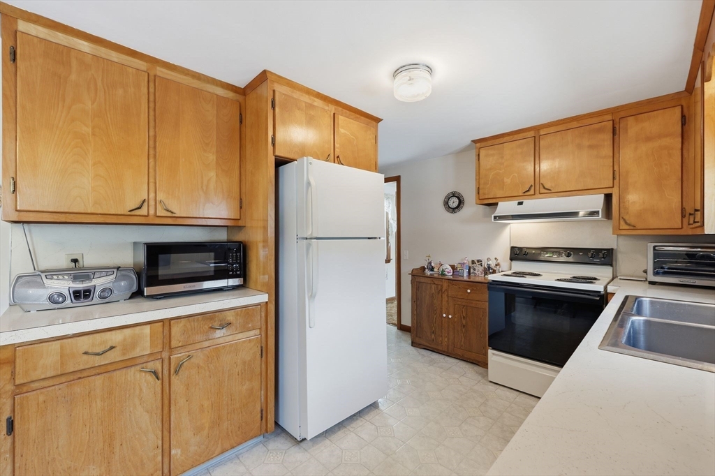 4452 High Street Palmer, MA 01069 - Photo 10 of 41 a kitchen with stainless steel appliances a refrigerator sink and microwave