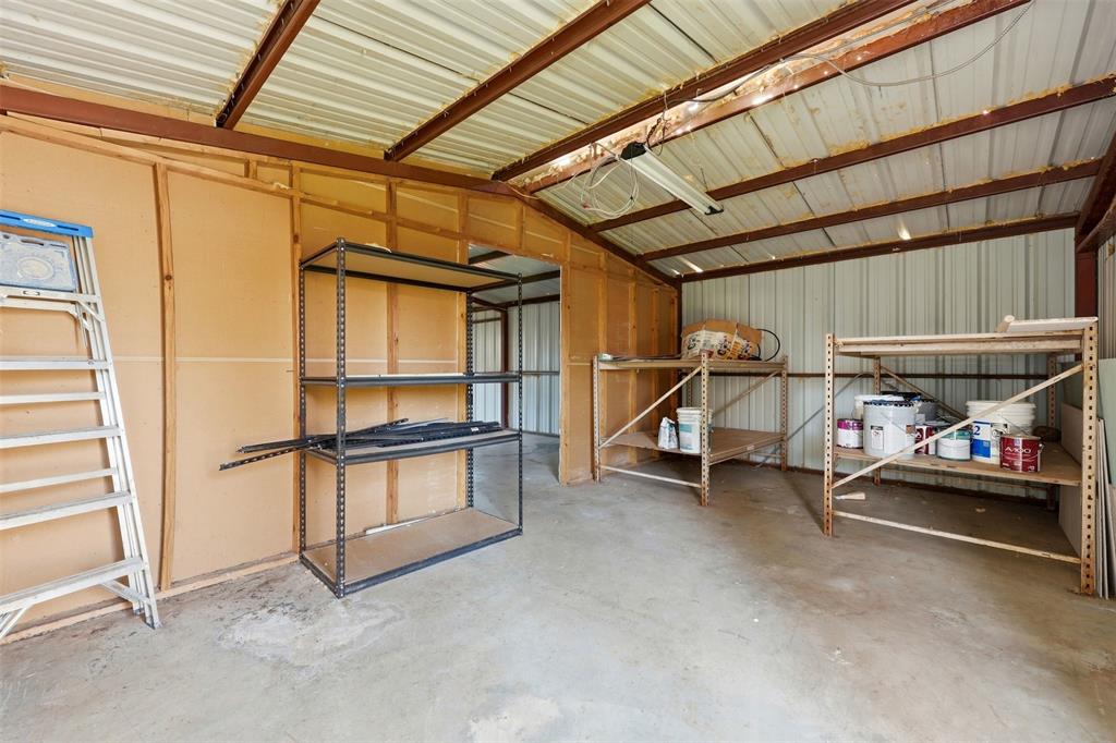 502 Madison Street Cleburne, TX 76033 - Photo 27 of 30 a view of a garage with furniture