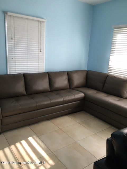 112 Poplar Avenue Deal, NJ 07723 - Photo 2 of 22 a living room with furniture and a window
