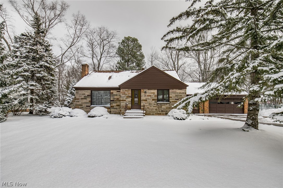 6473 Crossview Road Independence, OH 44131 - Photo 1 of 28 Stone and brick Cape Cod on sprawling homesite