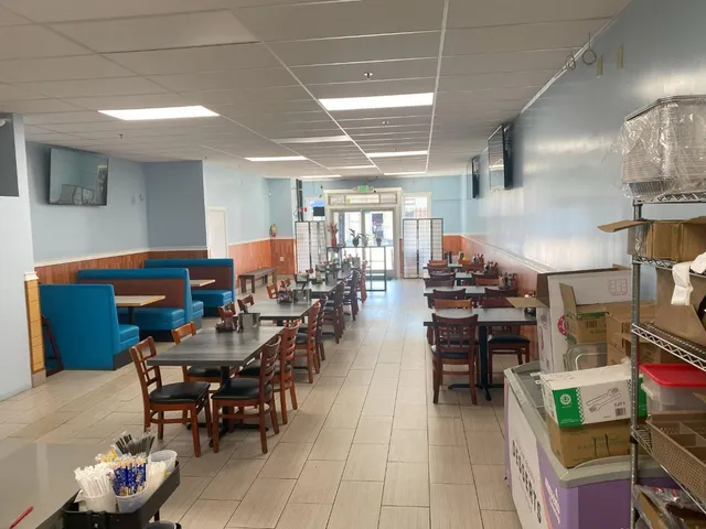 a view of a living room and kitchen