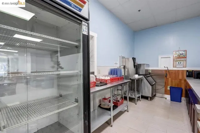 a stove top oven sitting inside of a kitchen