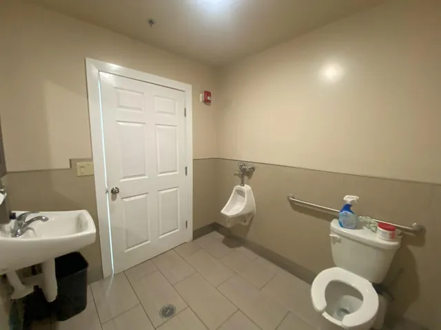 a kitchen with stainless steel appliances granite countertop a refrigerator a stove and a cabinets