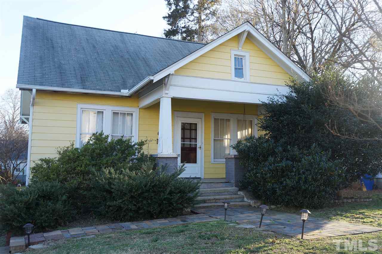 606 Sasser Street Raleigh, NC 27604 - Photo 1 of 22 a front view of house with yard and green space