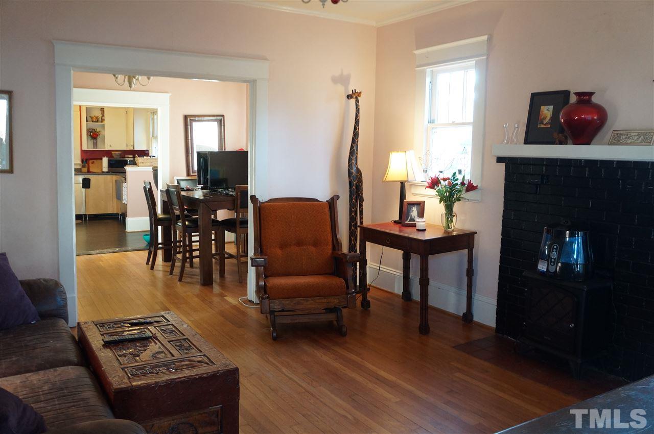 606 Sasser Street Raleigh, NC 27604 - Photo 5 of 22 a living room with furniture and a fireplace