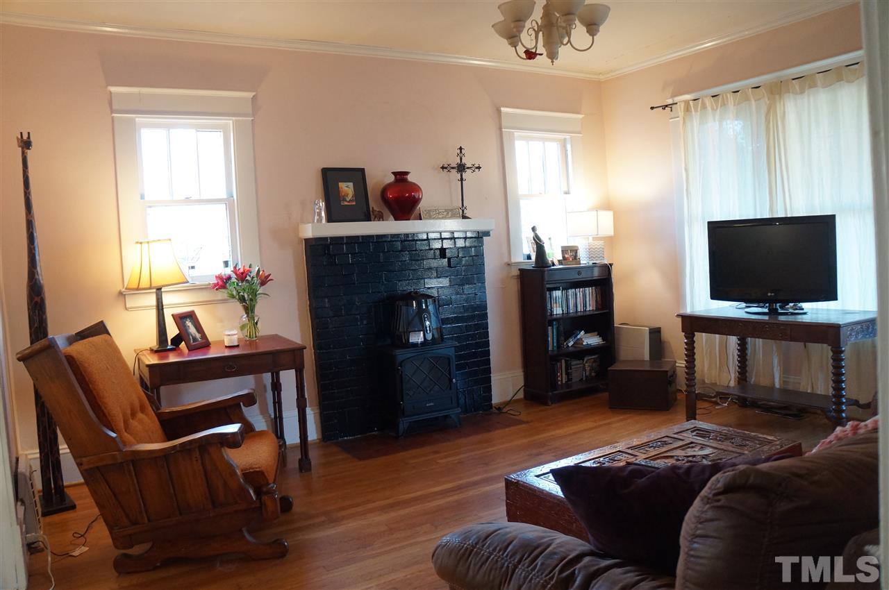 606 Sasser Street Raleigh, NC 27604 - Photo 6 of 22 a living room with furniture and a flat screen tv