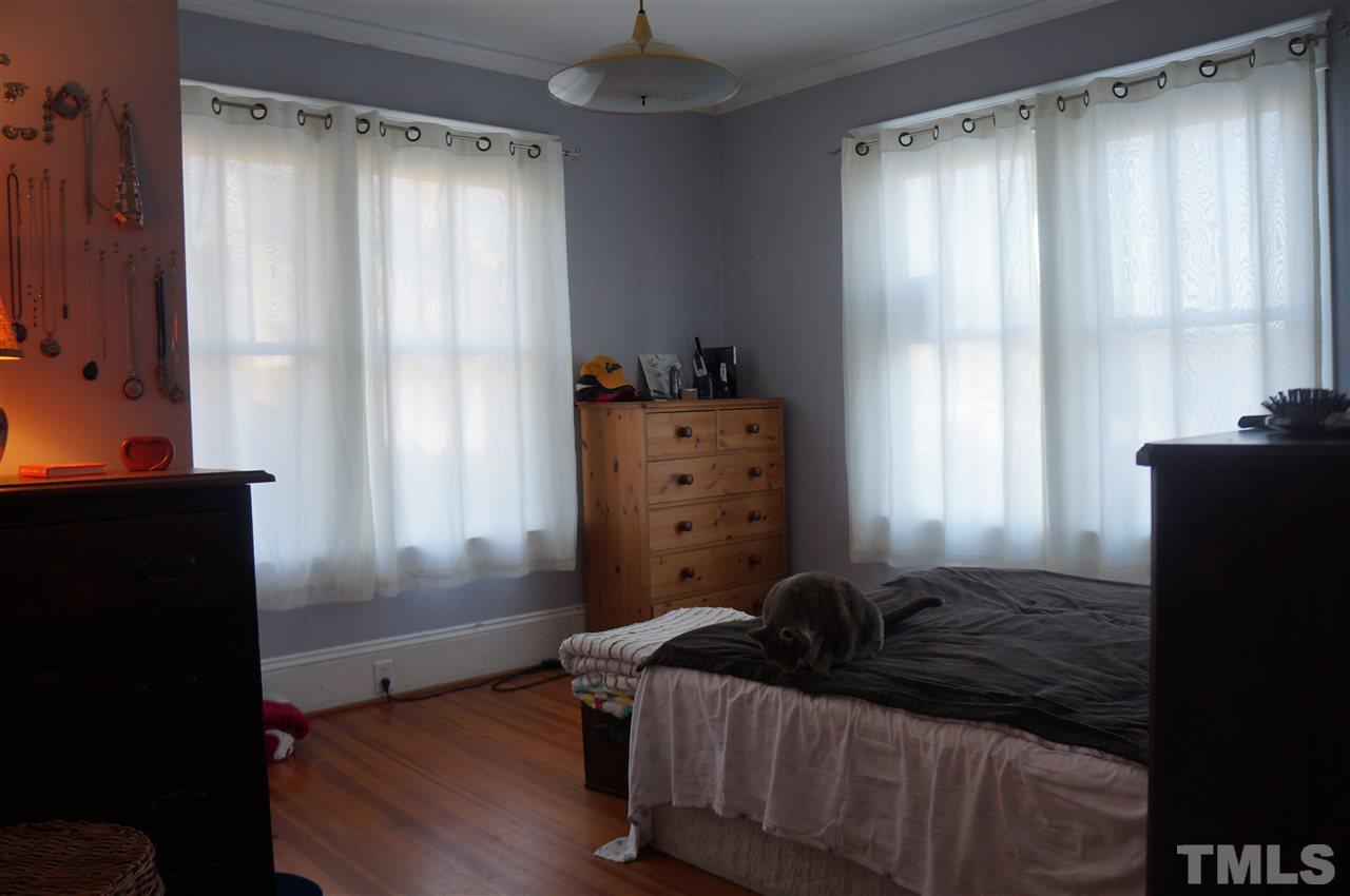 606 Sasser Street Raleigh, NC 27604 - Photo 7 of 22 a bed room with a bed and a window