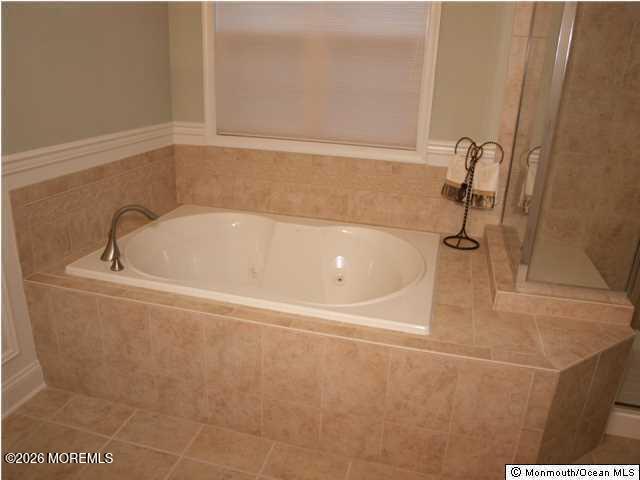 8 Fairhaven Way Waretown, NJ 08758 - Photo 5 of 68 a white bath tub sitting in a bathroom