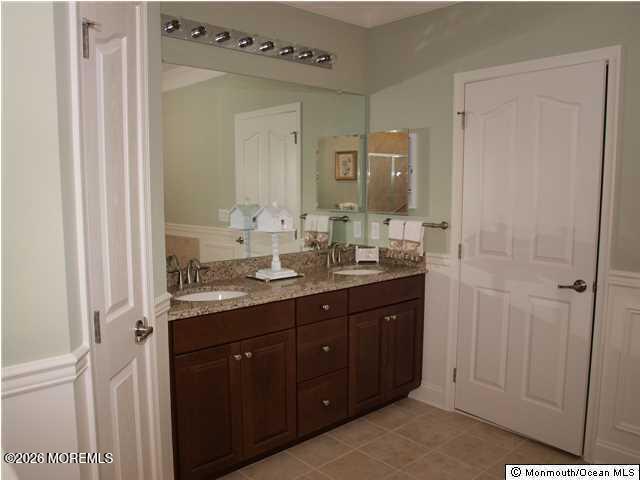 8 Fairhaven Way Waretown, NJ 08758 - Photo 6 of 68 a bathroom with a double vanity sink and mirror