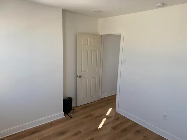 a view of a livingroom with wooden floor