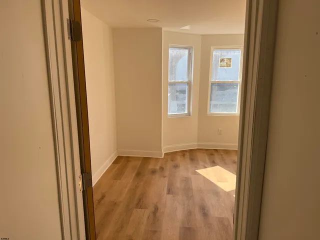 a view of an empty room and window