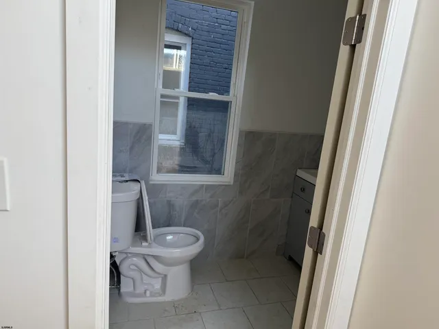 a bathroom with a toilet and a sink