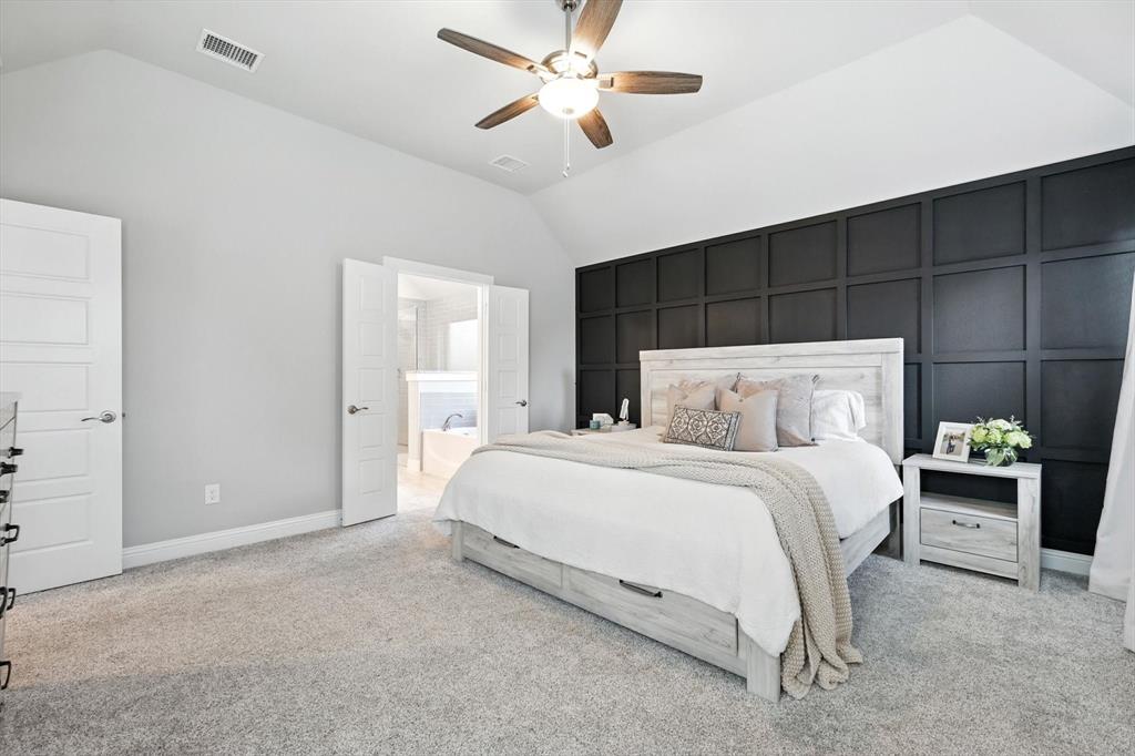 705 Chaparral Road Sanger, TX 76266 - Photo 20 of 38 a bedroom with a bed and a ceiling fan