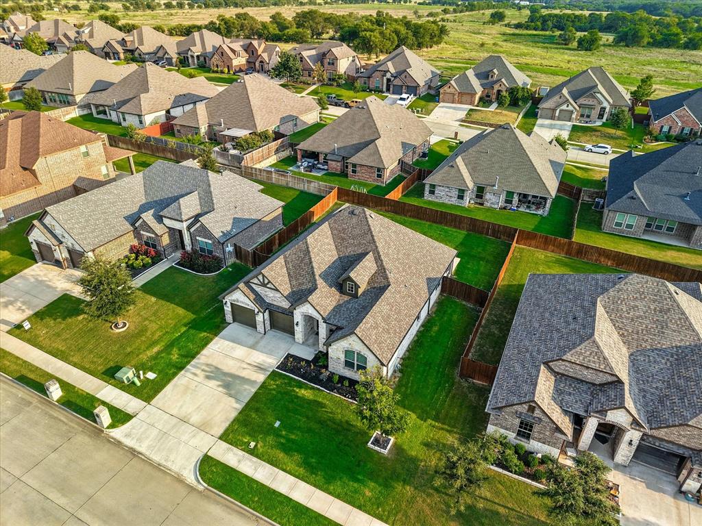 705 Chaparral Road Sanger, TX 76266 - Photo 36 of 38 an aerial view of a house with a swimming pool patio and outdoor seating