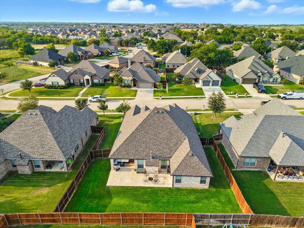 705 Chaparral Road Sanger, TX 76266 - Photo 37 of 38 an aerial view of a house with garden space and lake view