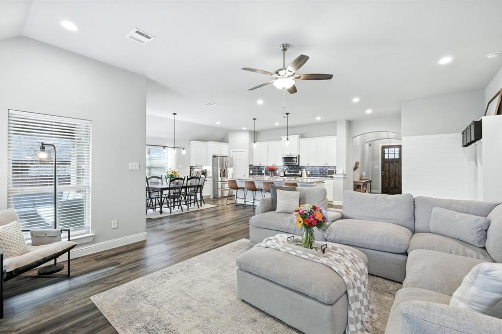 705 Chaparral Road Sanger, TX 76266 - Photo 4 of 38 a living room with furniture and kitchen view