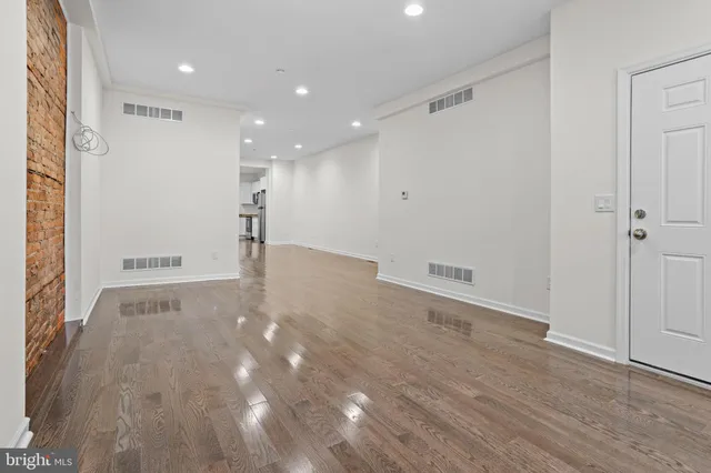 a view of a big room with wooden floor