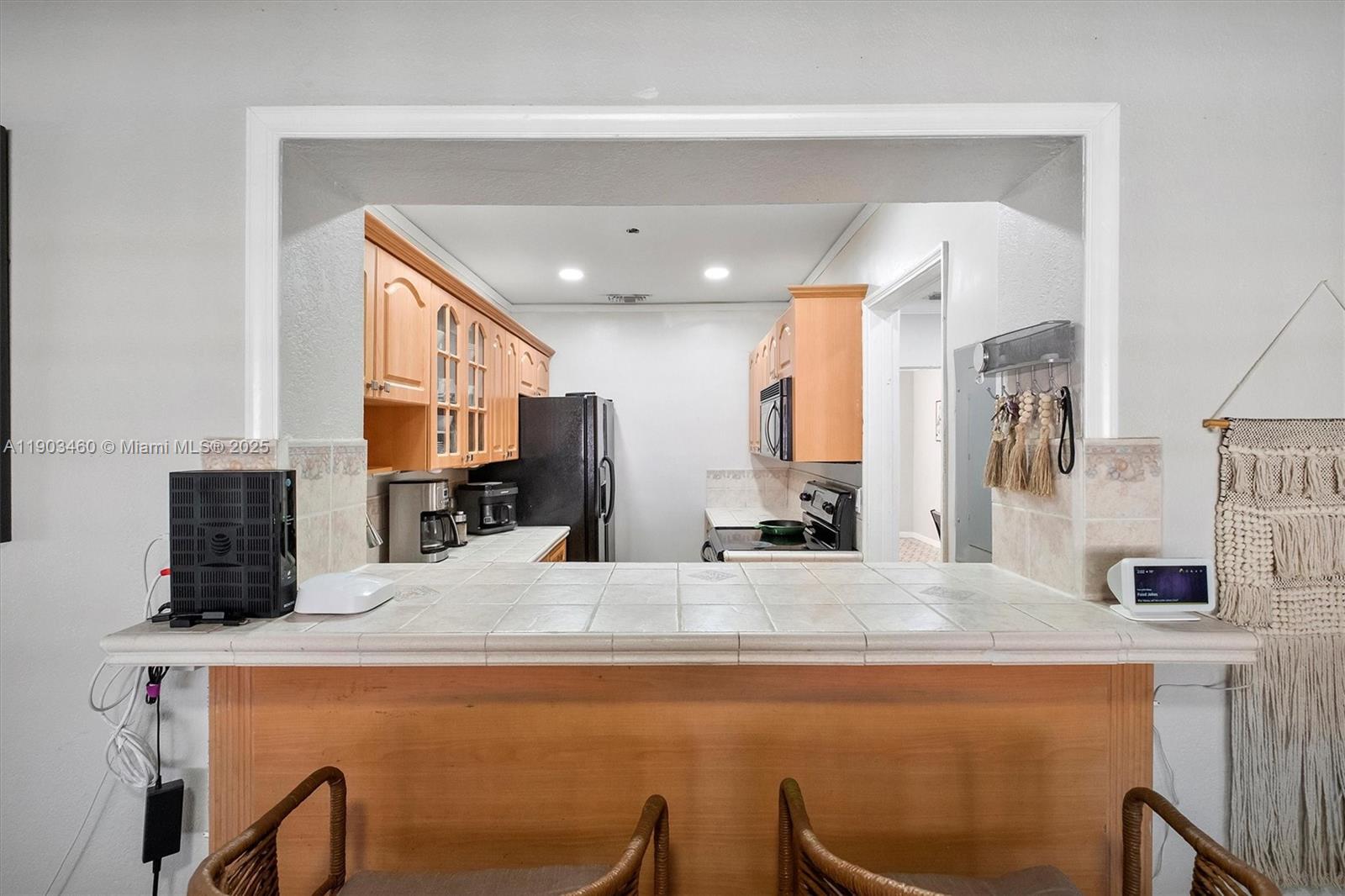 7231 Southwest 6th Street Miami, FL 33144 - Photo 15 of 34 a large kitchen with stainless steel appliances a sink and a fireplace