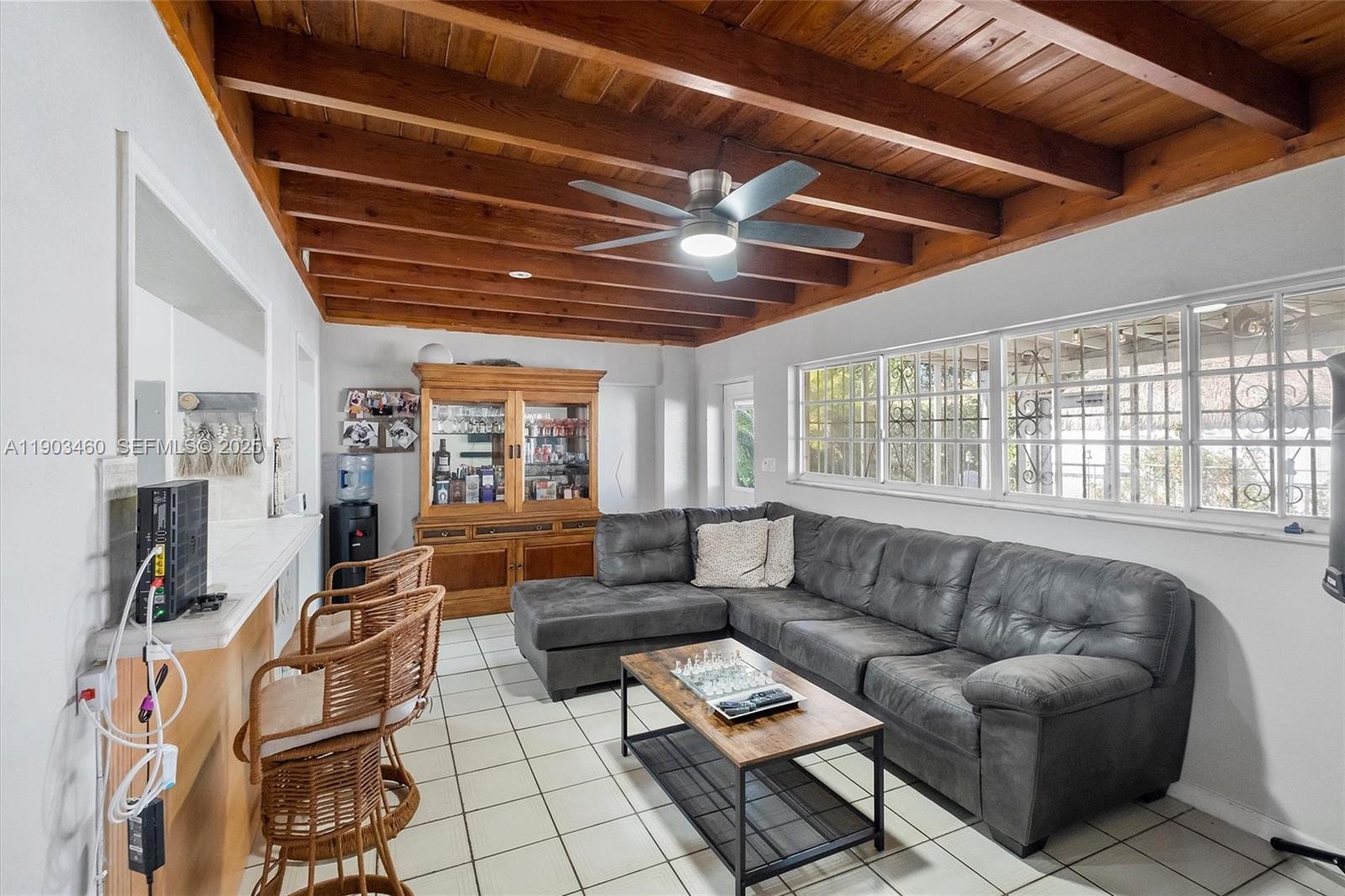 7231 Southwest 6th Street Miami, FL 33144 - Photo 16 of 34 a living room with furniture and a large window