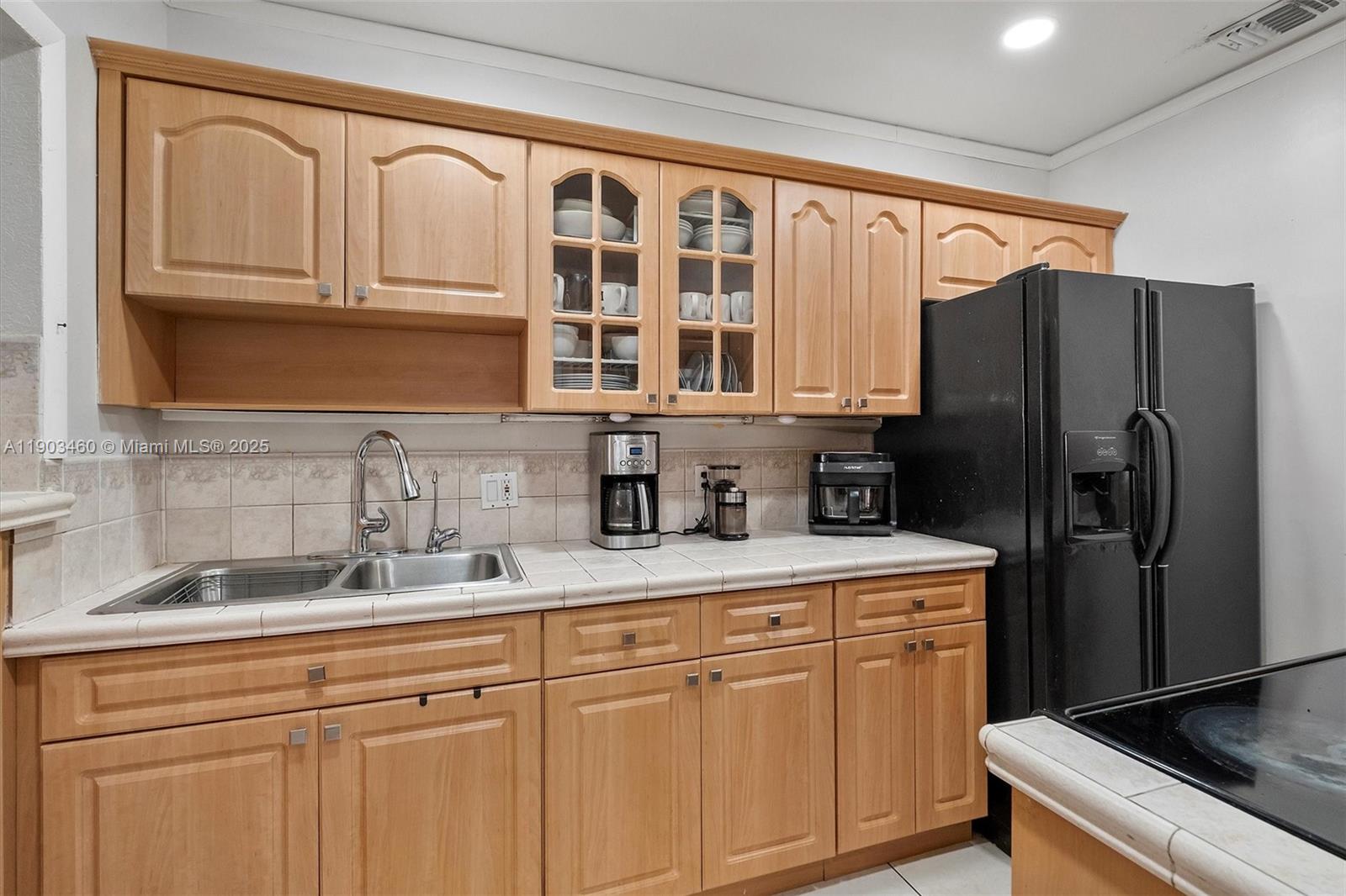 7231 Southwest 6th Street Miami, FL 33144 - Photo 6 of 34 a kitchen with stainless steel appliances granite countertop a refrigerator and a sink