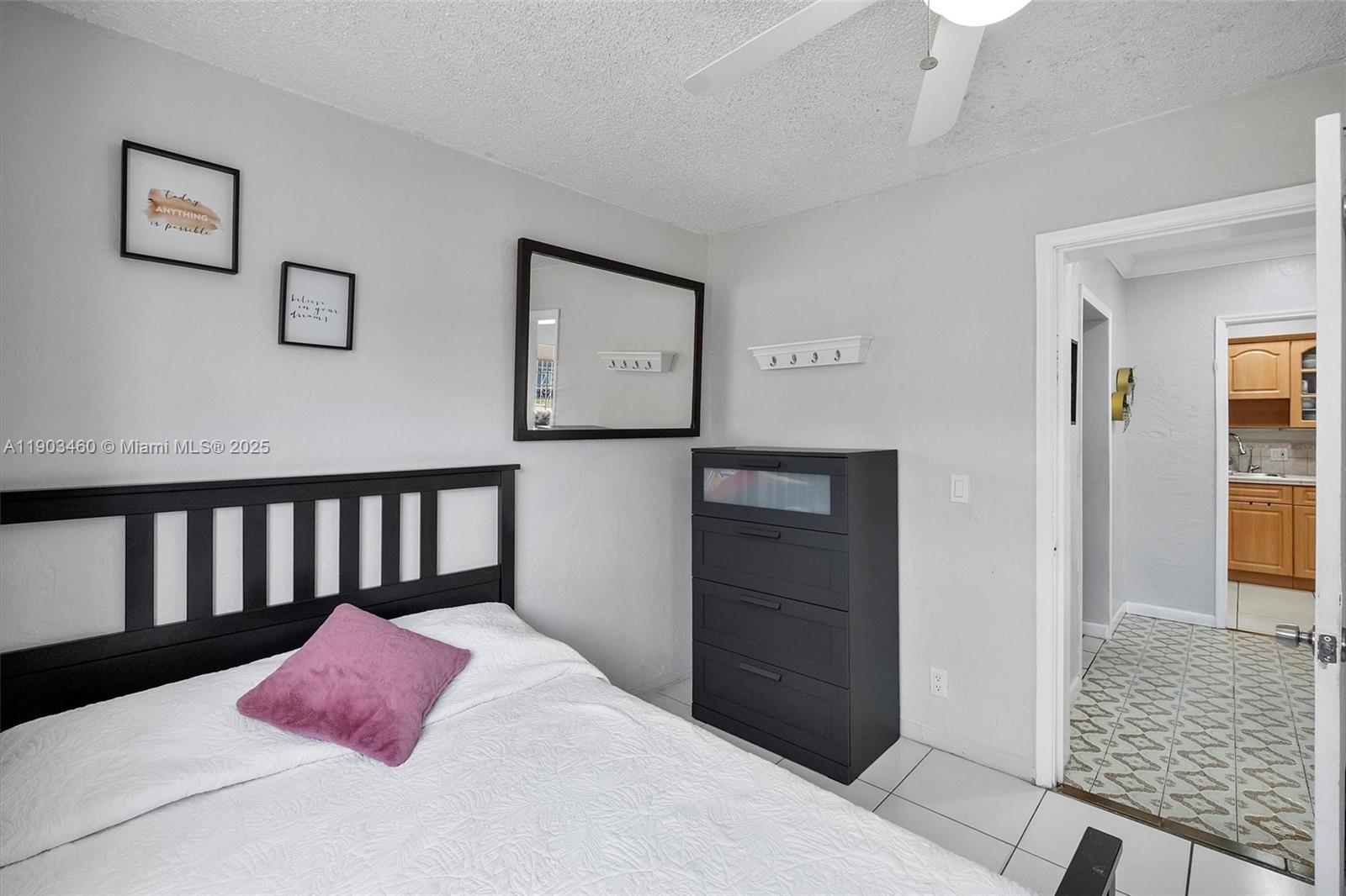 7231 Southwest 6th Street Miami, FL 33144 - Photo 8 of 34 a bedroom with a bed and a walk in closet