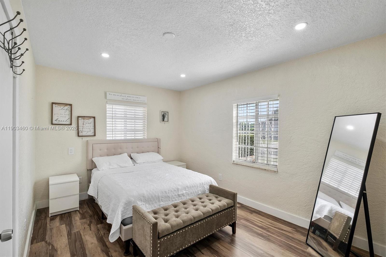 7231 Southwest 6th Street Miami, FL 33144 - Photo 9 of 34 a bedroom with a large bed and a window