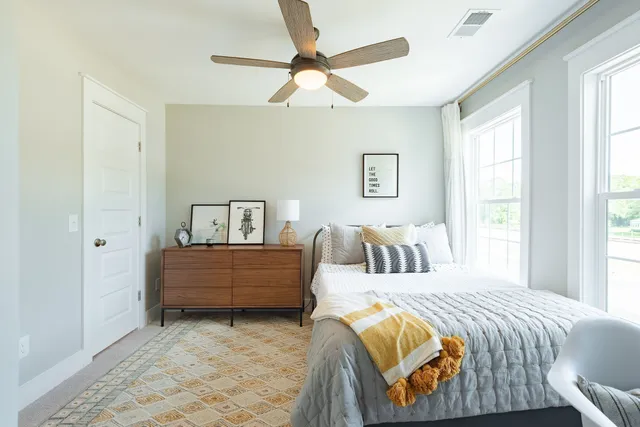 a bedroom with a bed and window