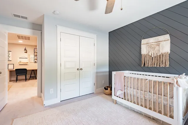 a bedroom with windows