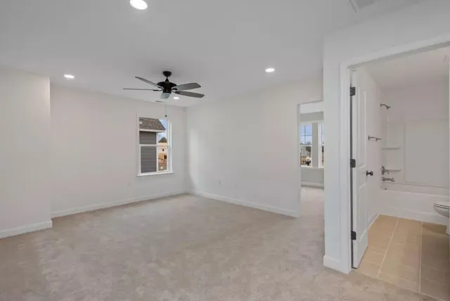 a view of a livingroom with a chandelier fan