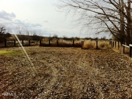 101 Byron Road Prosser, WA 99350 - Photo 4 of 14 a view of a dry yard with wooden fence