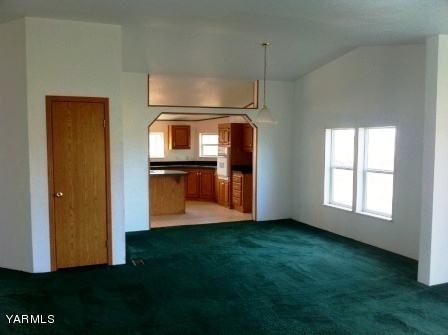101 Byron Road Prosser, WA 99350 - Photo 10 of 14 a kitchen with kitchen island wooden floor and a sink