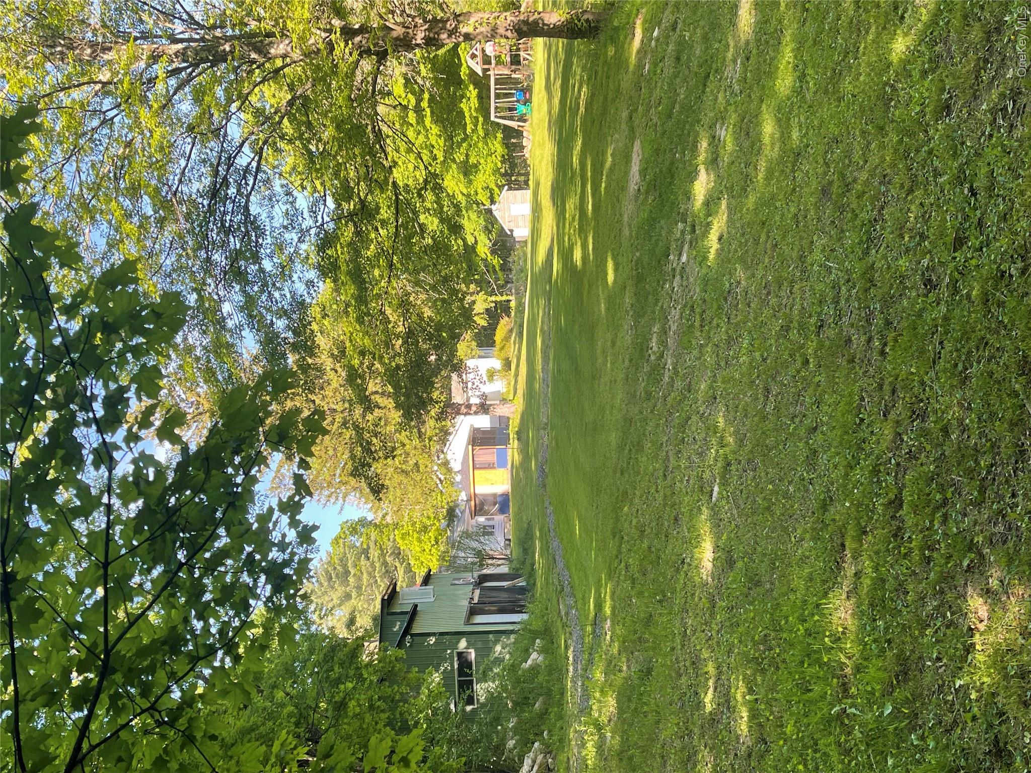 894 Upper Mountain Road Pine Bush, NY 12566 - Photo 27 of 35 View of grassy yard featuring an outdoor structure and a playground