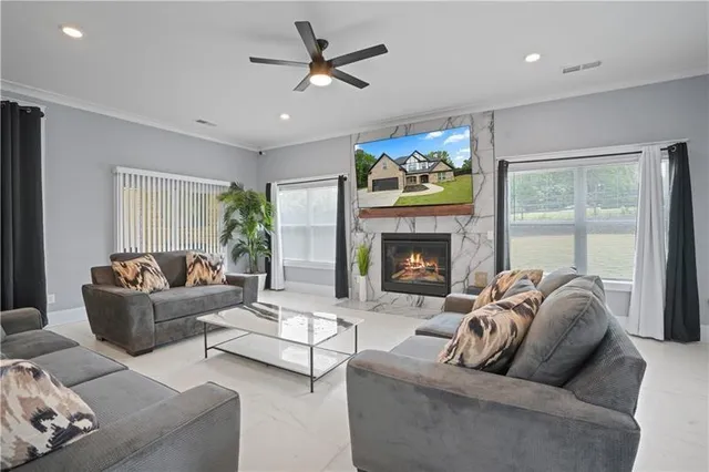 a kitchen with stainless steel appliances kitchen island granite countertop a sink and a refrigerator