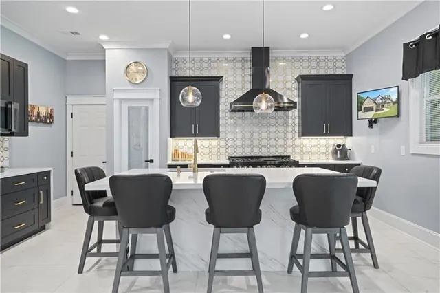 a kitchen with granite countertop a stove and cabinets