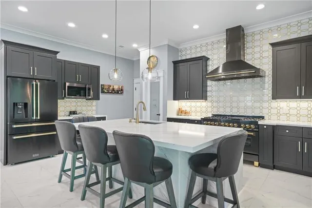 a large kitchen with a table and chairs