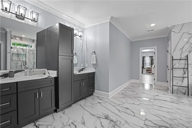 a bedroom with a bed couch and wooden floor