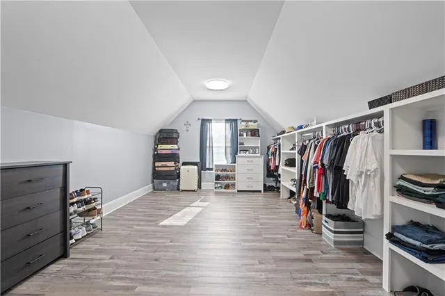 a bathroom with a granite countertop bathtub shower sink and toilet